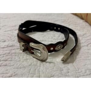 Western  tooled leather hip belt with silver conch details